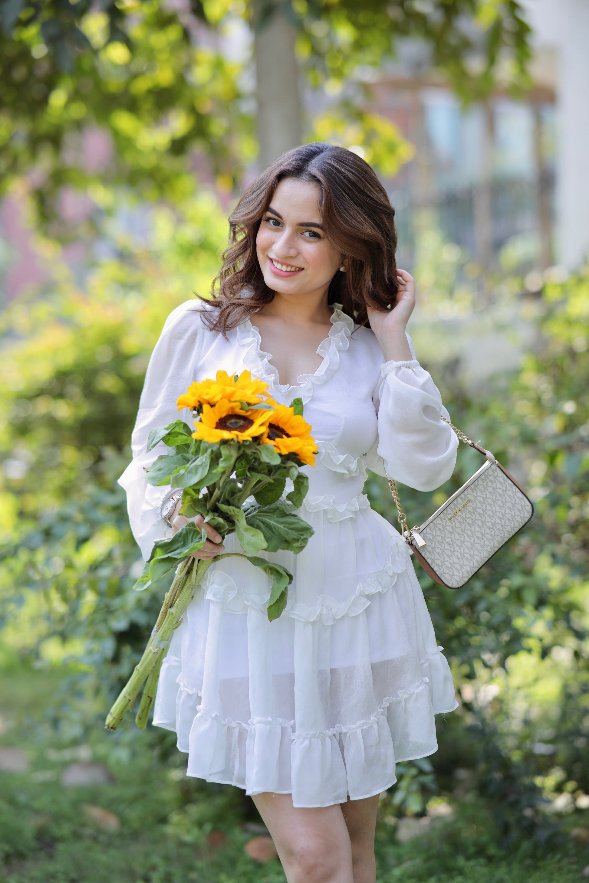 Imagine by Shiwali Vanessa White Frill Dress shown on a model, featuring ruffled details and a stylish, lightweight summer design.