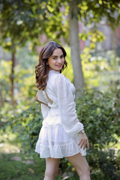Imagine by Shiwali Vanessa White Frill Dress, lightweight fabric with ruffled details and a feminine silhouette, shown on a model.