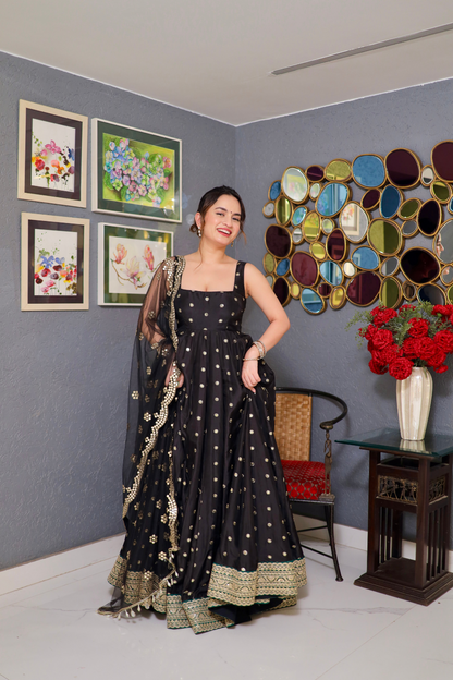 Black Zoya Anarkali dress by Imagine By Shiwali, featuring intricate embroidery and flowing fabric.