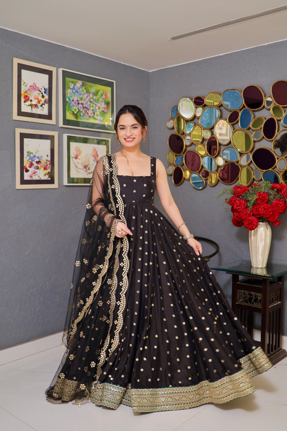 Imagine By Shiwali Zoya black anarkali with intricate embroidery and flowing fabric, showcased in this elegant traditional dress image.