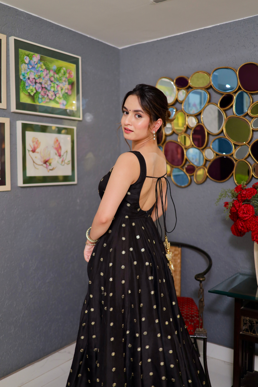 Black Zoya Anarkali dress by Imagine By Shiwali with intricate embroidery and flowing fabric, displayed on a hanger.