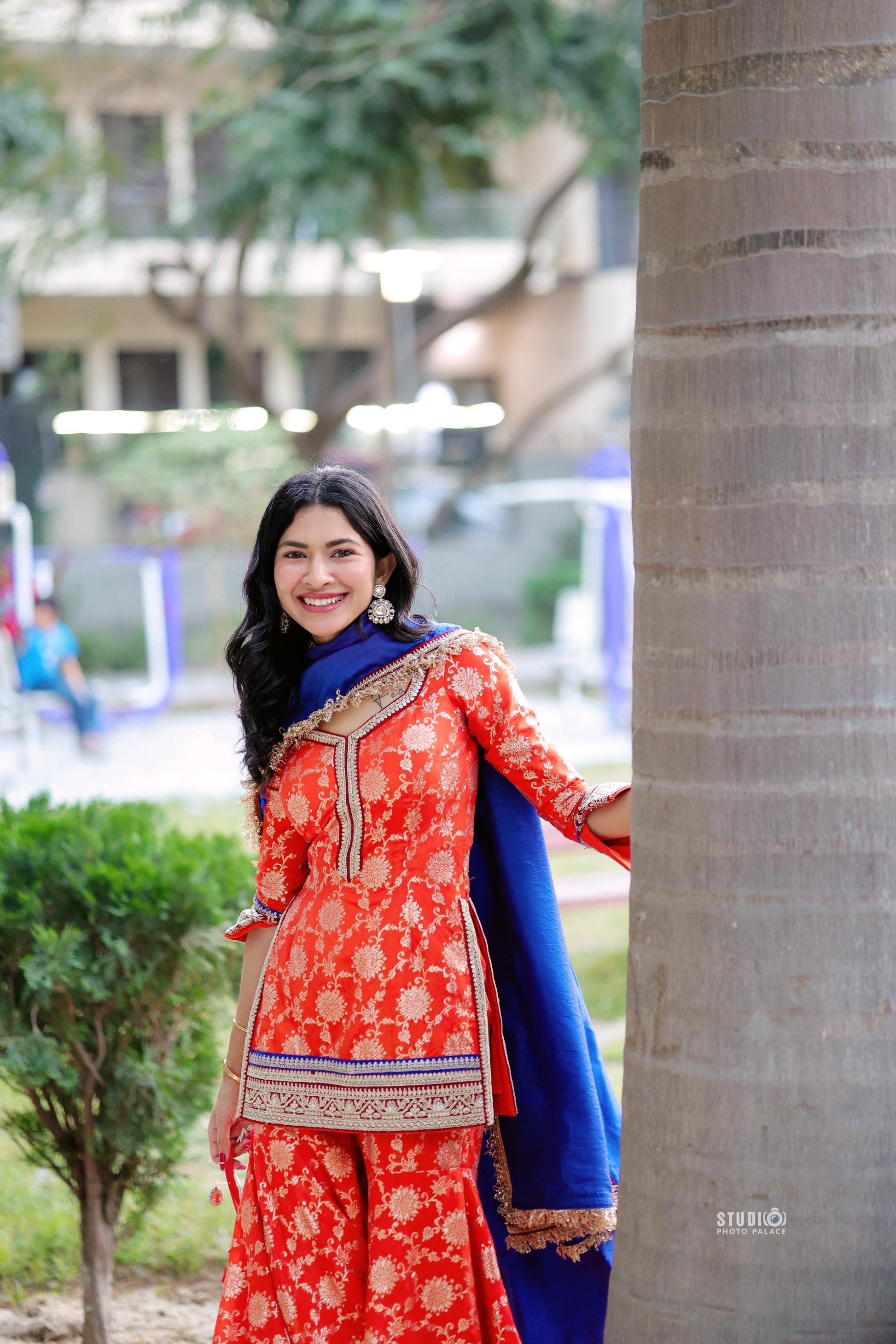Orange and blue Abhilasha Sharara set by Imagine By Shiwali featuring a traditional embroidered top with matching wide-leg trousers.