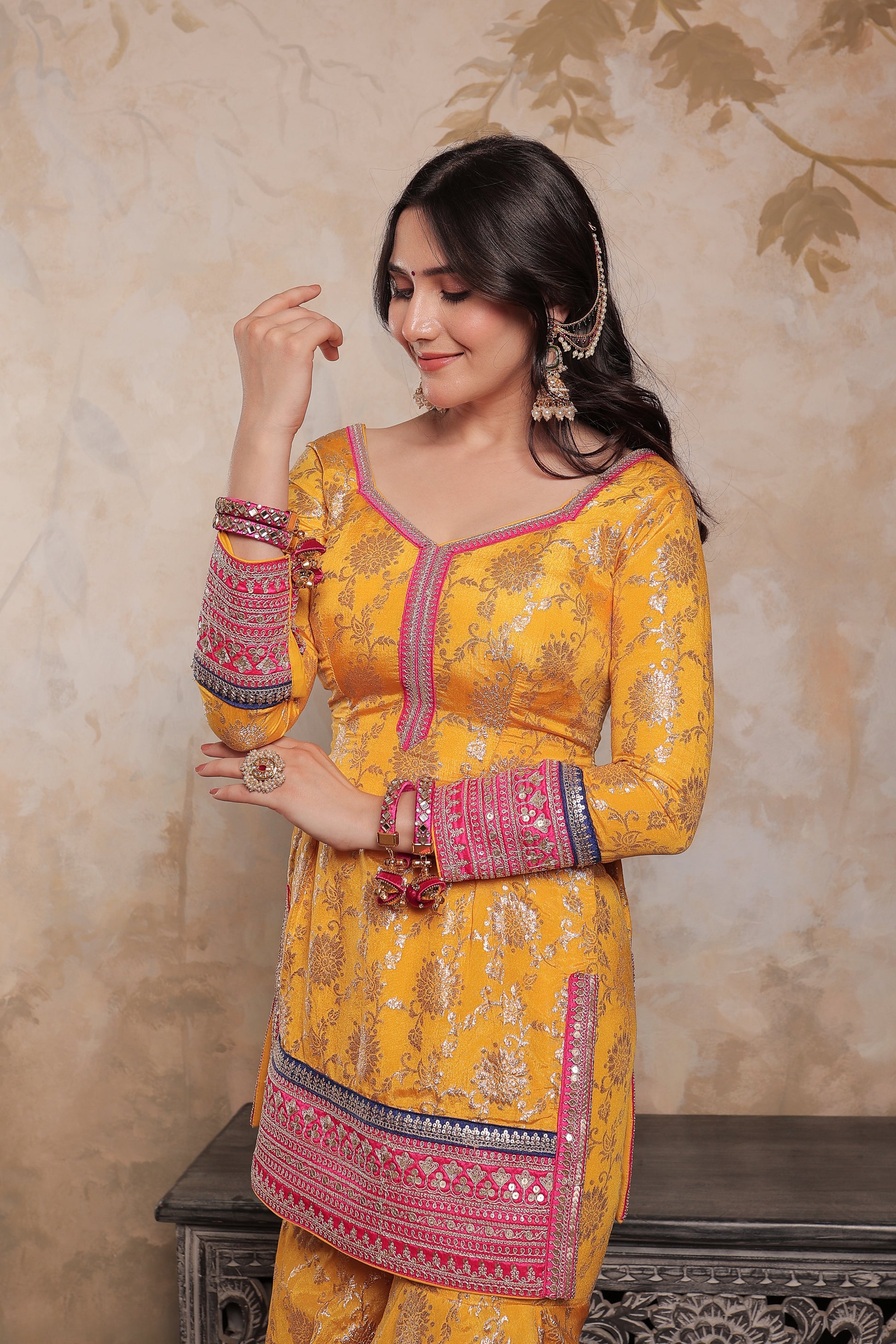 Yellow and pink Abhilasha sharara suit by Imagine By Shiwali, featuring intricate embroidery and traditional design.