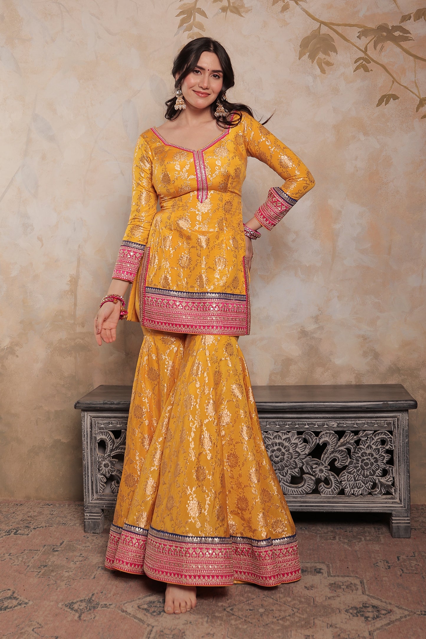 Yellow and pink Abhilasha sharara suit by Imagine By Shiwali, featuring traditional embroidery and vibrant fabric details.