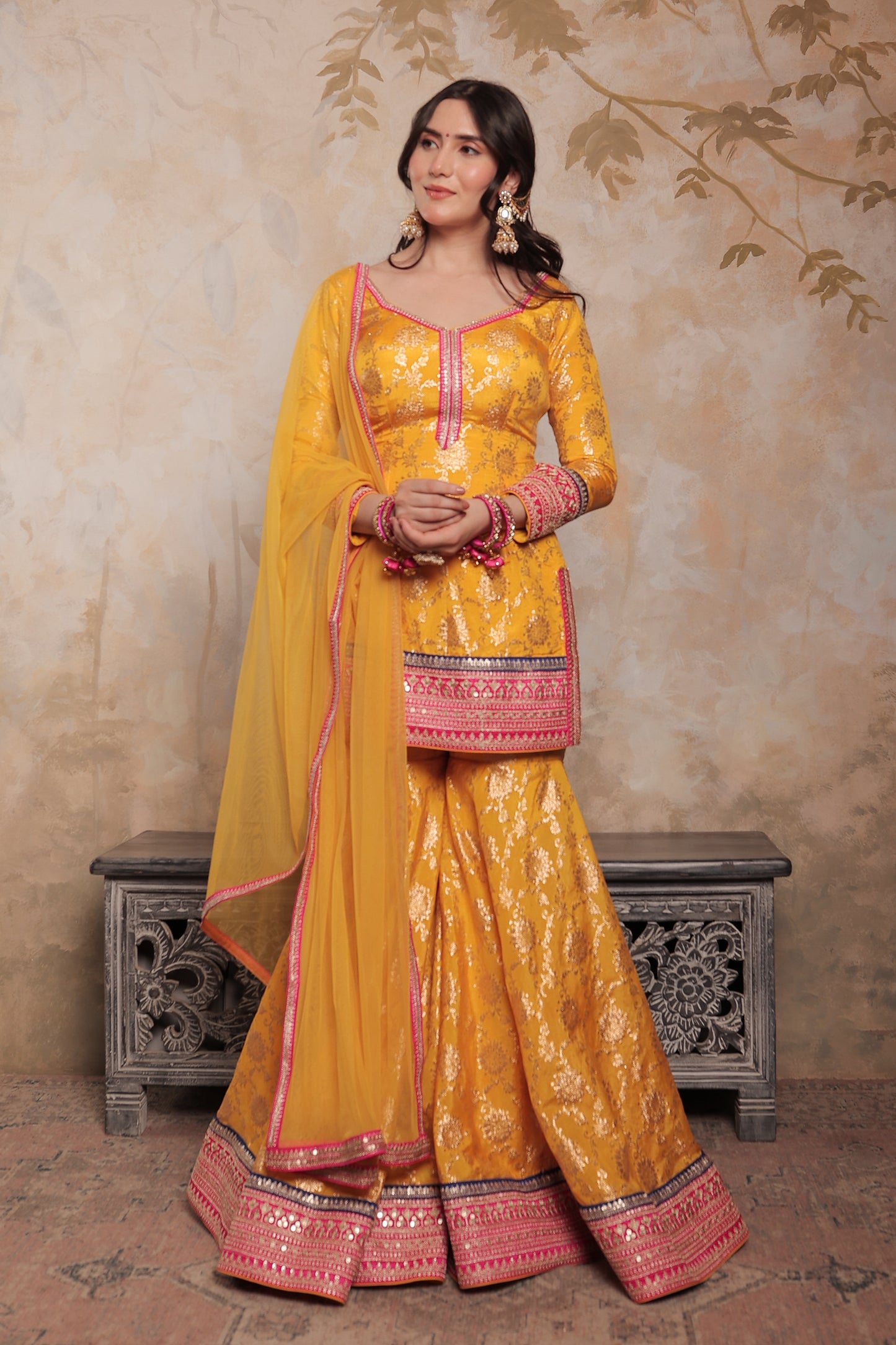 Yellow and pink Abhilasha sharara suit by Imagine By Shiwali featuring intricate embroidery and traditional styling.