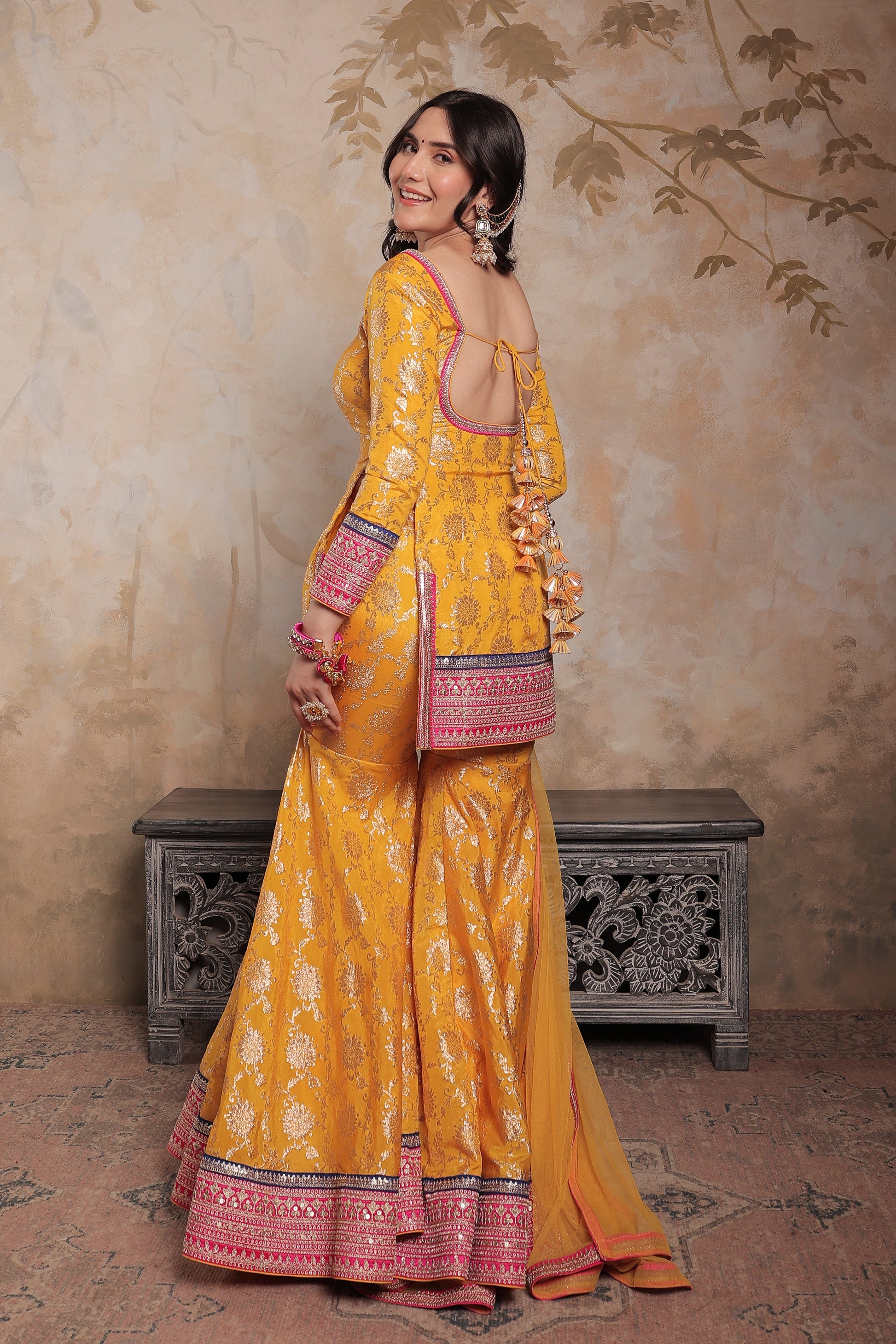 Yellow and pink Abhilasha sharara suit by Imagine By Shiwali, featuring intricate embroidery and traditional Indian styling.