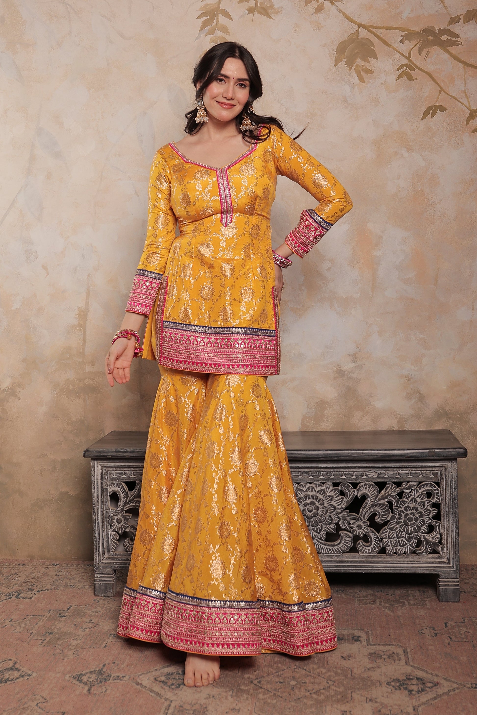 Yellow and pink Abhilasha sharara suit by Imagine By Shiwali, featuring intricate embroidery and traditional styling.