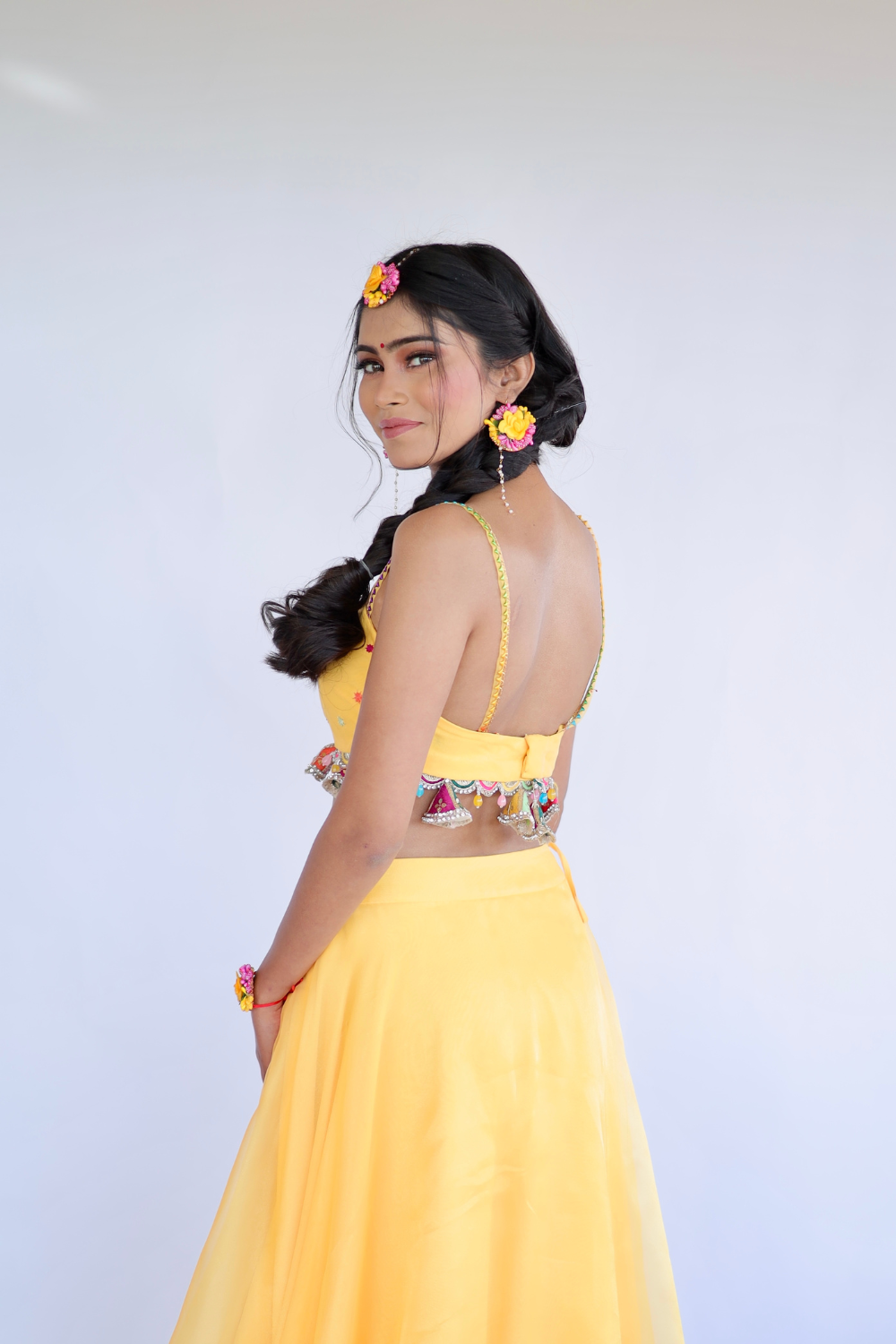 Yellow Amara Lehnga by Imagine Shiwali with intricate embroidery and traditional design, displayed on a dress form.