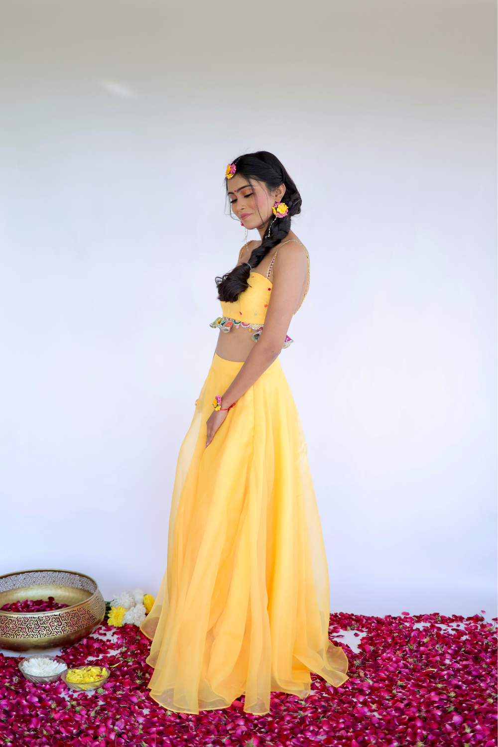 Imagine By Shiwali Amara Yellow Lehnga featuring intricate embroidery and flowing fabric, perfect for traditional celebrations.