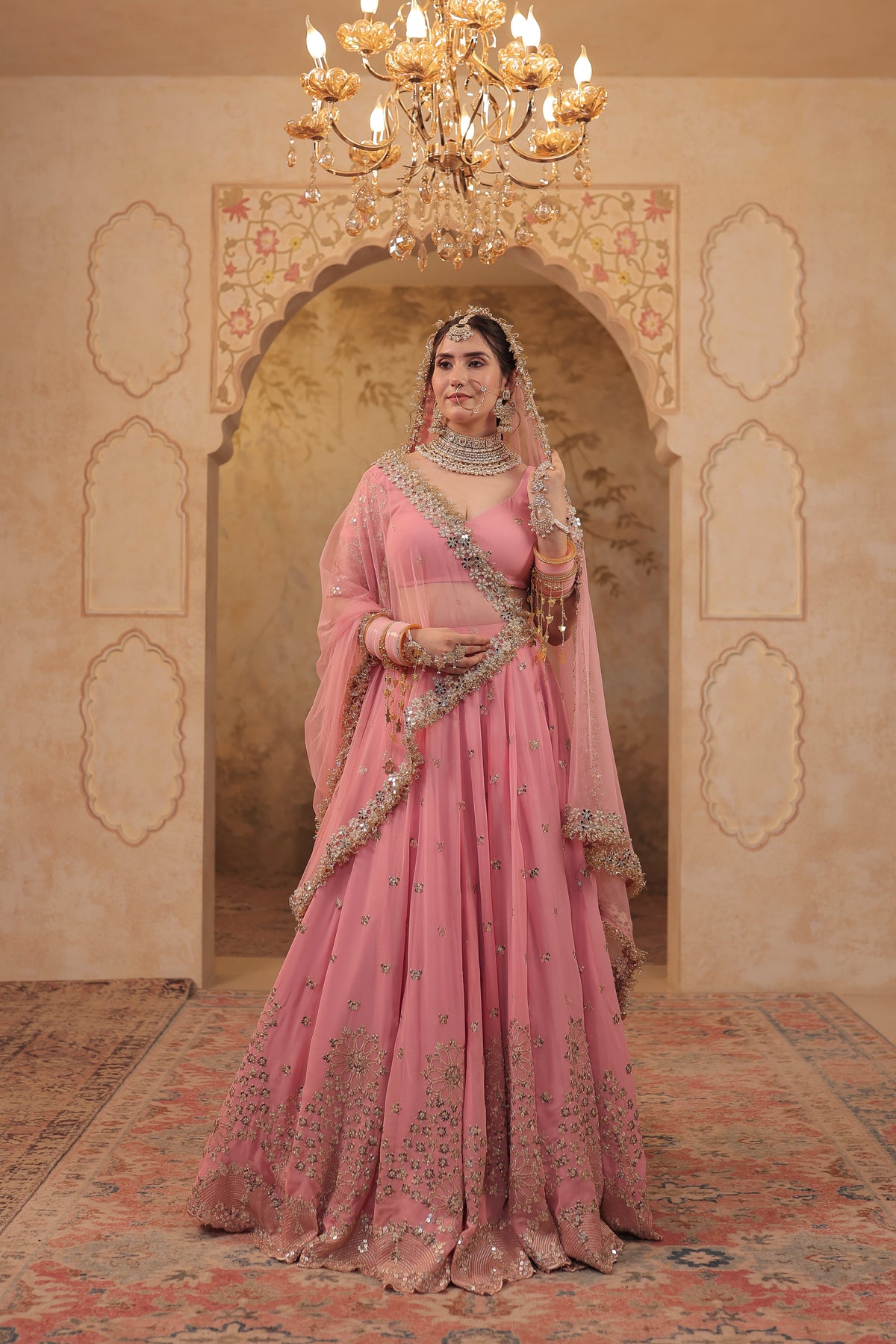 About Arzu soft pink bridal lehnga