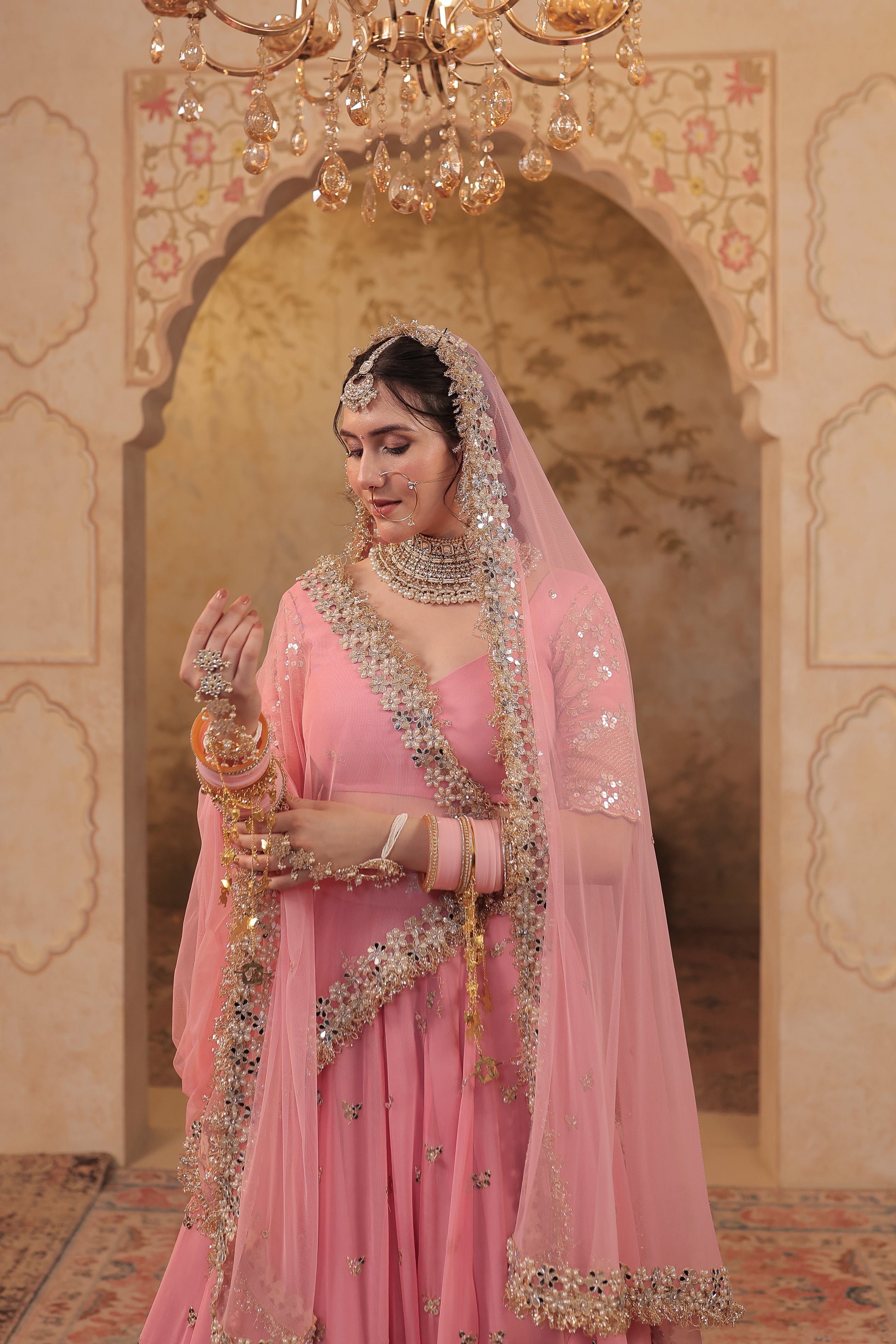 Soft pink bridal lehnga by Imagine By Shiwali featuring intricate embroidery and traditional design for special occasions.