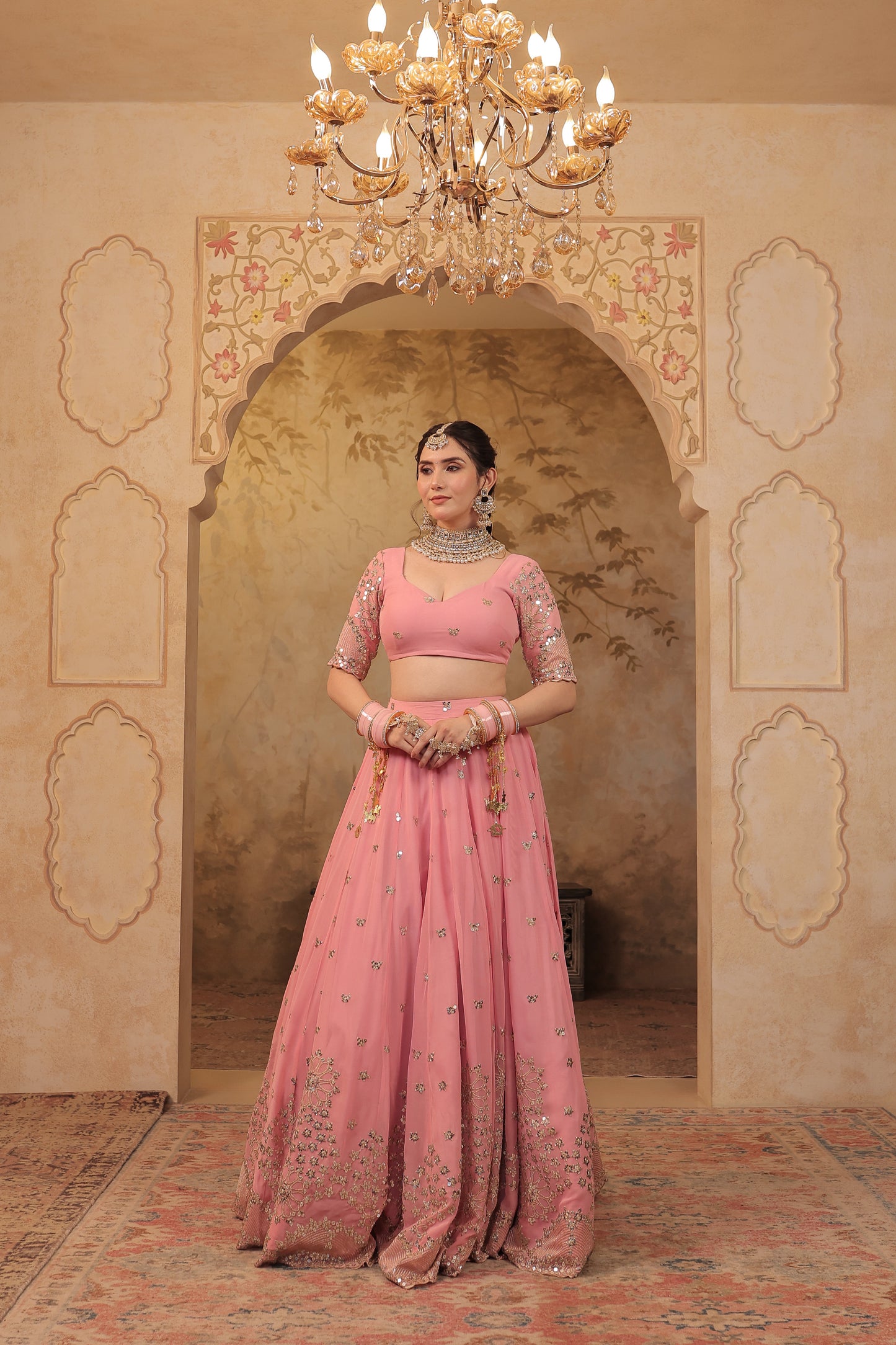 Soft pink bridal lehnga by Imagine by Shiwali featuring intricate embroidery and traditional design for special occasions.