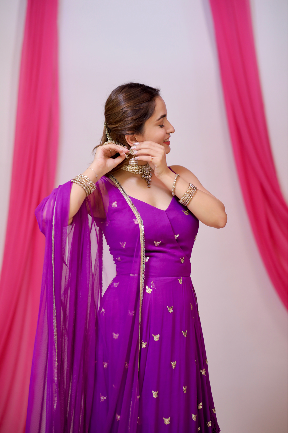 Violet Aza Angrakha-style Anarkali suit by Imagine by Shiwali featuring intricate embroidery and flowing fabric.