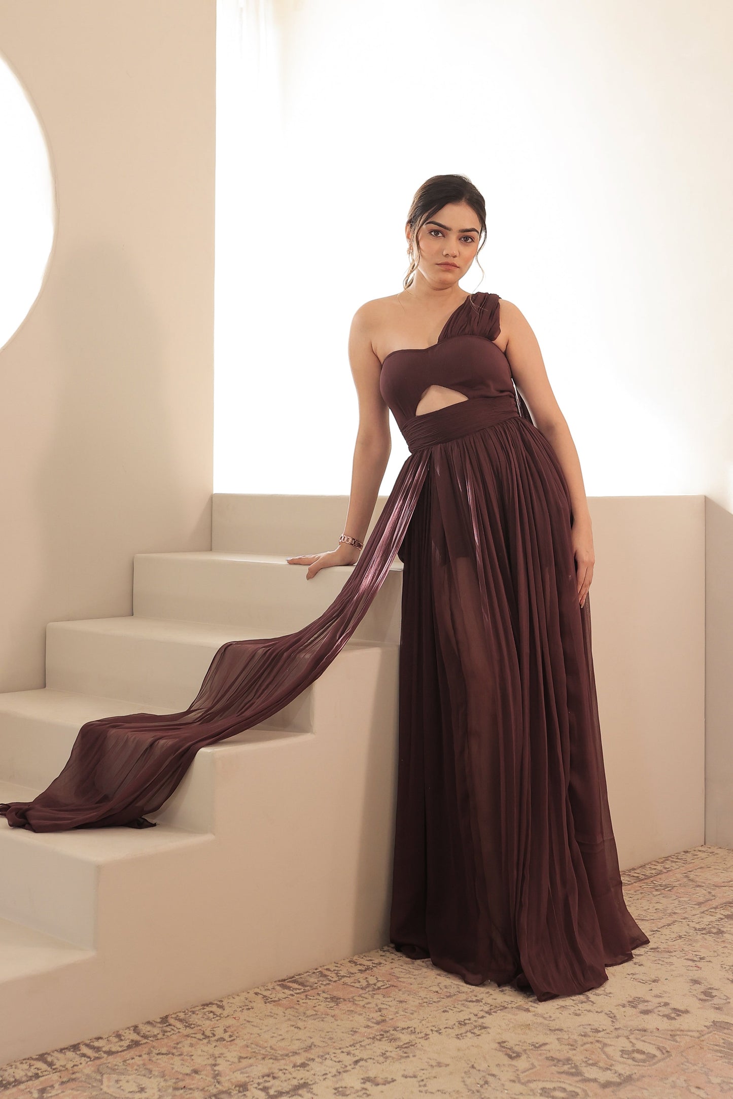 Imagine by Shiwali Britney brown gown featuring elegant fabric and a flowing silhouette, perfect for formal occasions.