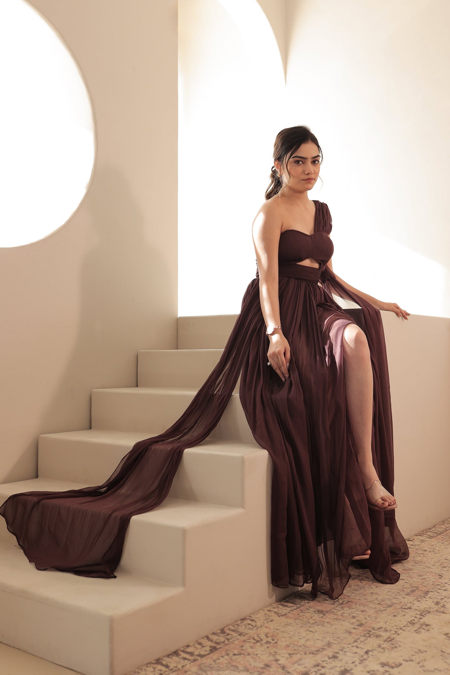 Imagine By Shiwali Britney brown gown shown with flowing fabric and elegant design on a model.