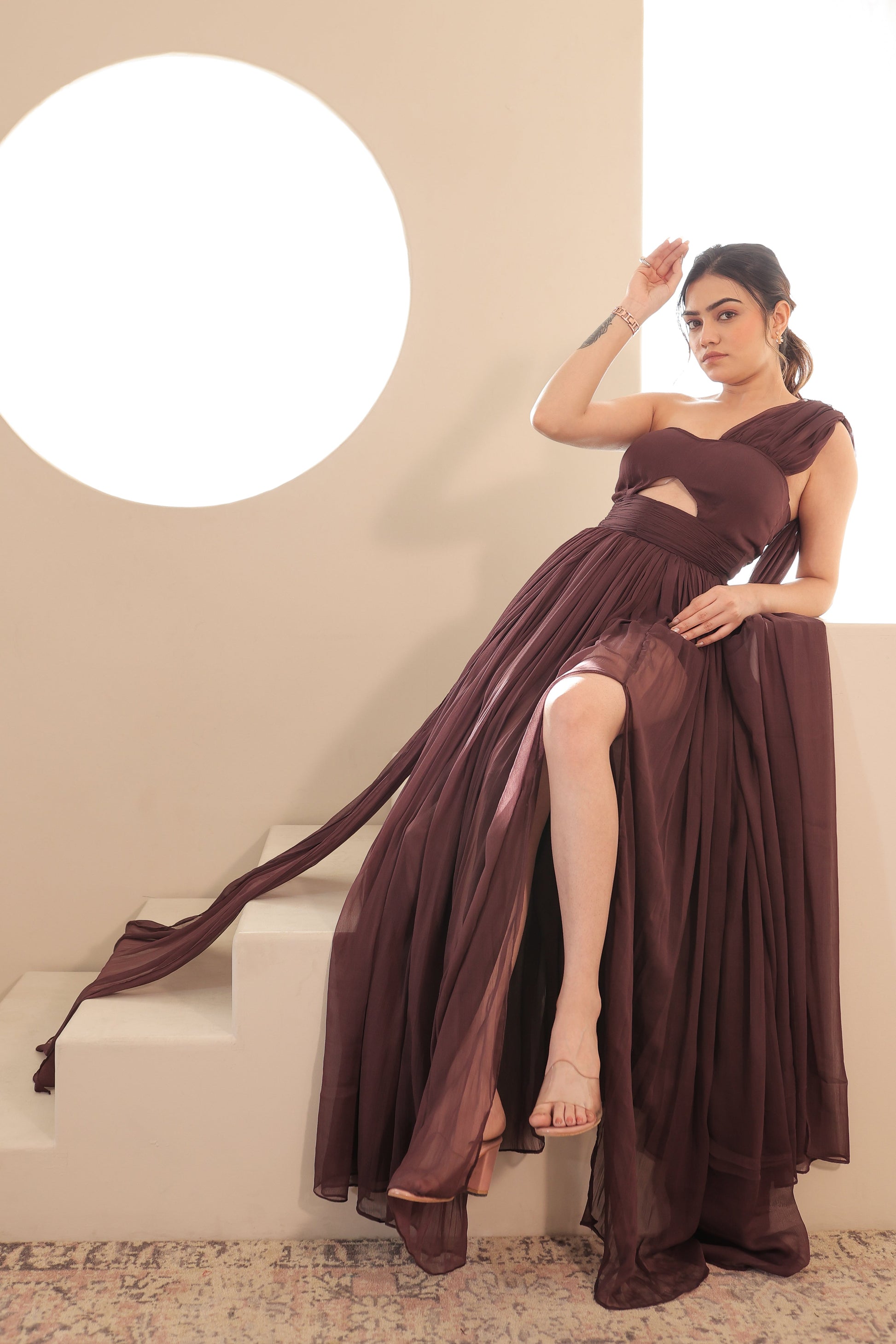Imagine By Shiwali Britney brown gown featuring flowy fabric and elegant design, shown on a model.