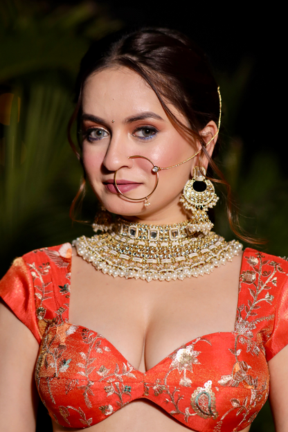 Chandani orange lehenga with intricate zari work by Imagine By Shiwali, featuring detailed embroidery and traditional design.