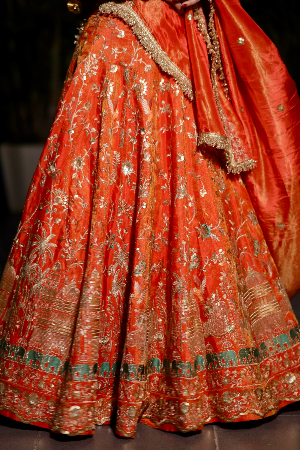Chandani orange lehenga with intricate zari work by Imagine By Shiwali, featuring detailed embroidery and traditional design.