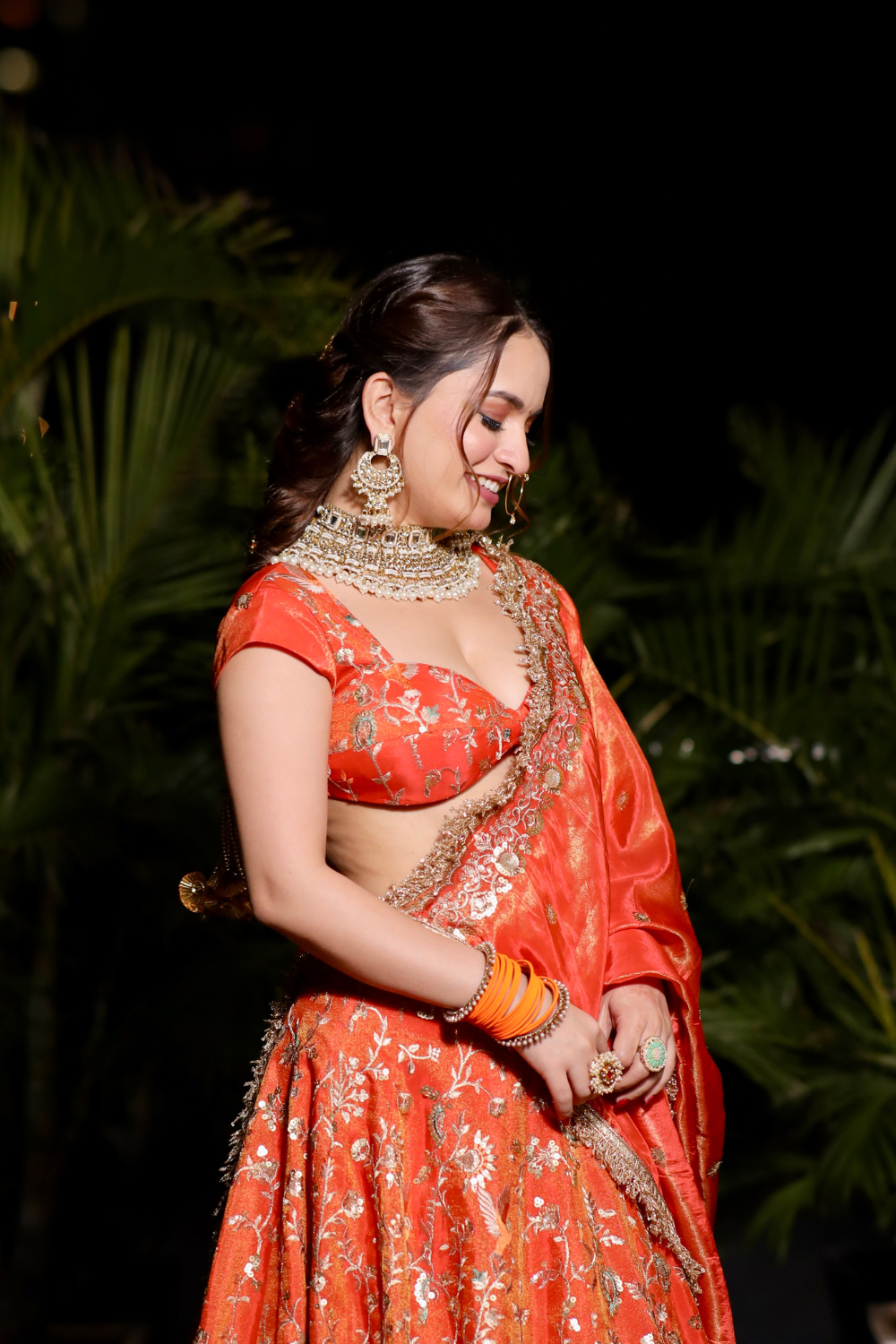 Chandani orange lehnga with intricate zari work by Imagine By Shiwali, showcasing detailed embroidery and vibrant fabric.