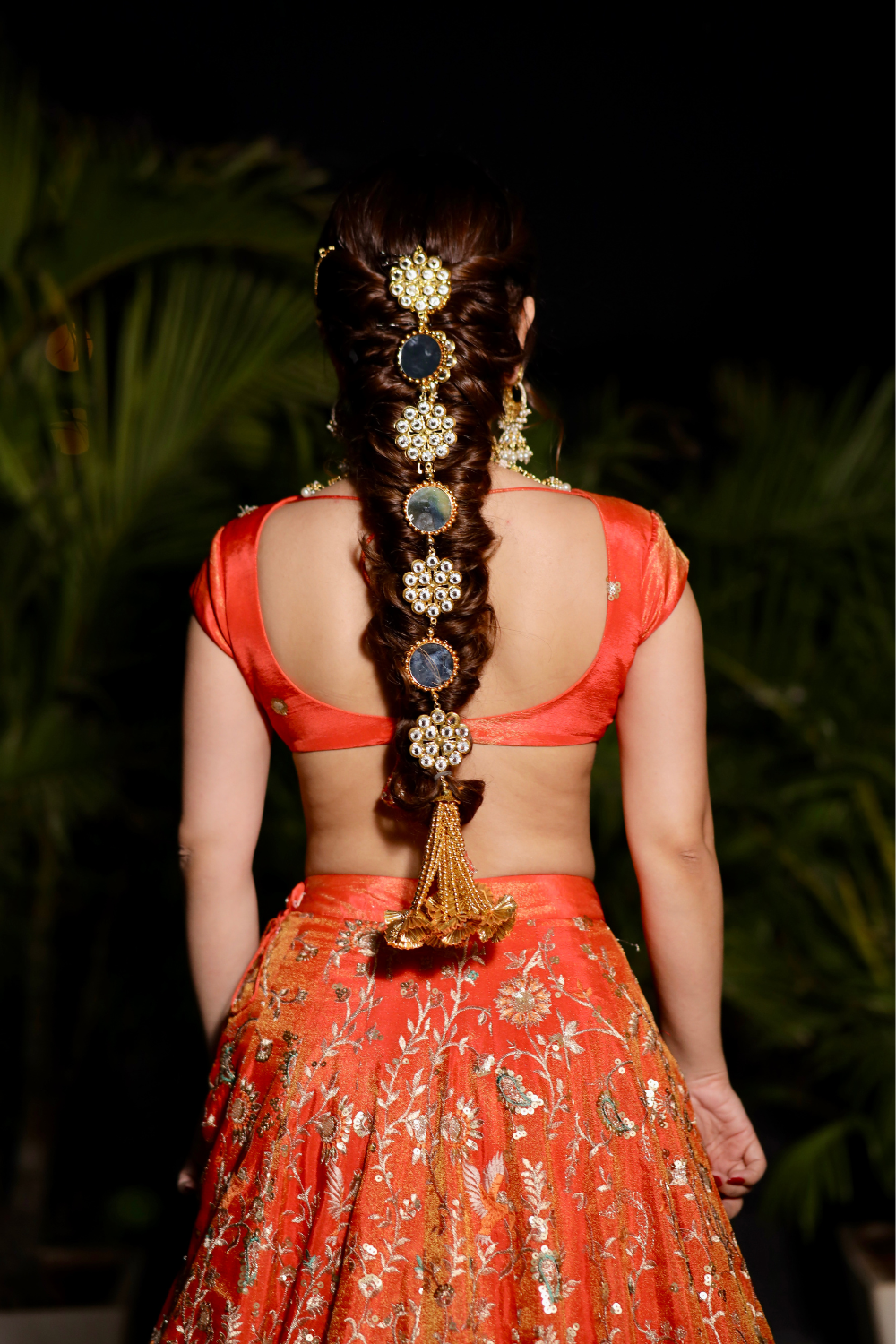 Chandani orange lehnga with intricate zari work and traditional design, crafted by Imagine By Shiwali.