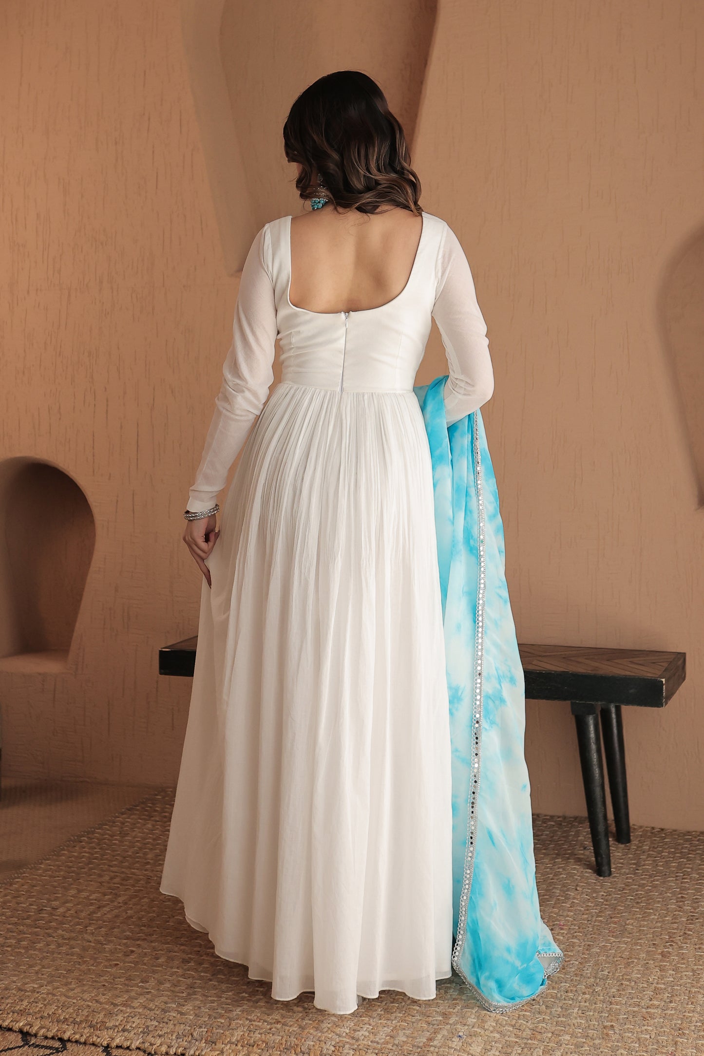 Elegant Chandani white mulmul Anarkali dress by Imagine By Shiwali, showcasing delicate fabric and intricate design details.