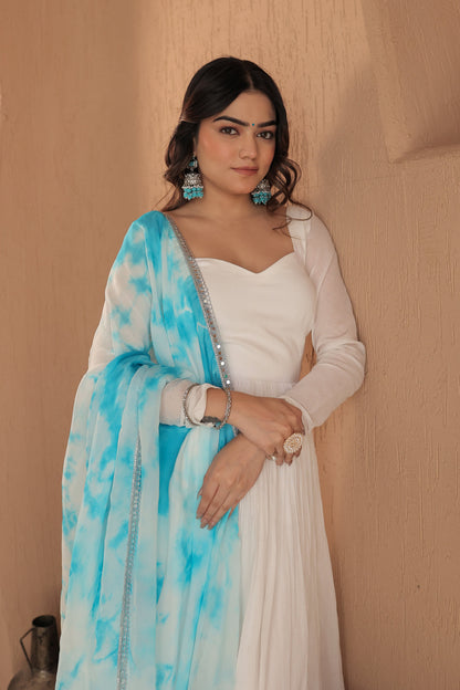 White Chandani mulmul anarkali dress by Imagine By Shiwali, detailed with traditional embroidery and flowy fabric.