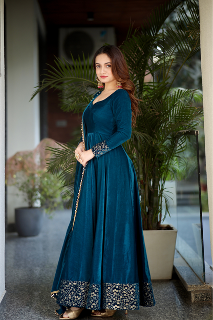 Sea green Deepika Velvet Anarkali dress by Imagine By Shiwali, featuring intricate embroidery and flowing fabric.