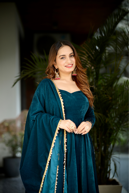 Sea green Deepika Velvet Anarkali dress by Imagine By Shiwali featuring intricate embroidery and a flowing silhouette.