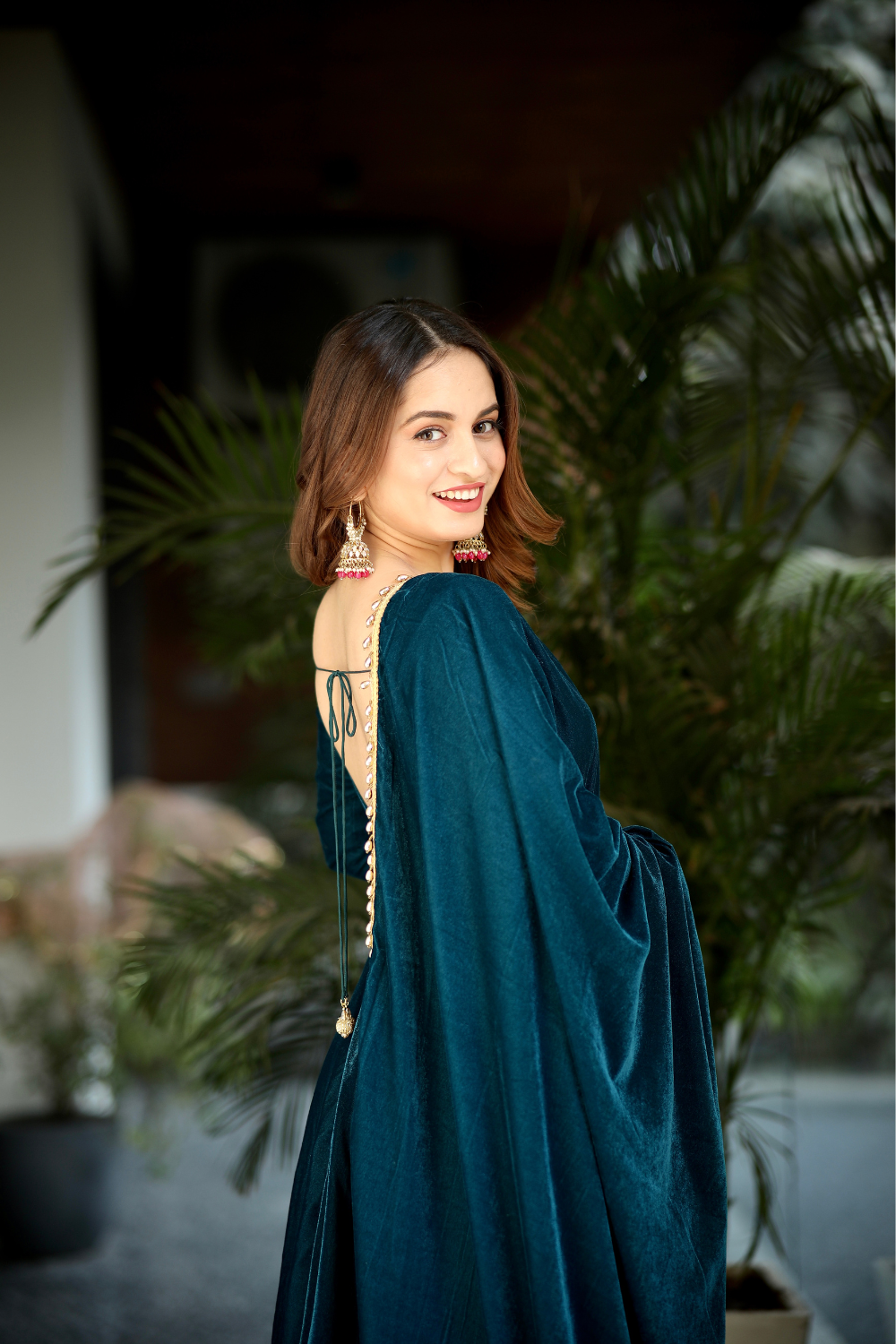 Sea green Velvet Anarkali dress by Imagine By Shiwali, featuring intricate embroidery and flowing fabric.