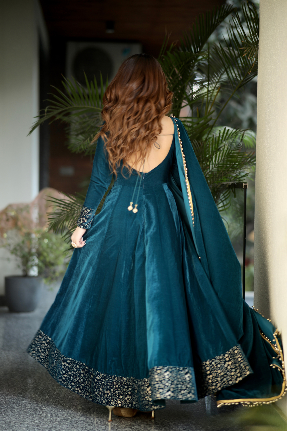 Sea green Deepika Velvet Anarkali dress by Imagine By Shiwali, featuring intricate embroidery and flowing fabric.