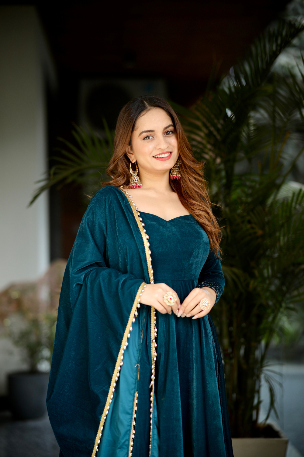 Sea green velvet Deepika Anarkali dress by Imagine By Shiwali, featuring intricate embroidery and flowing fabric.