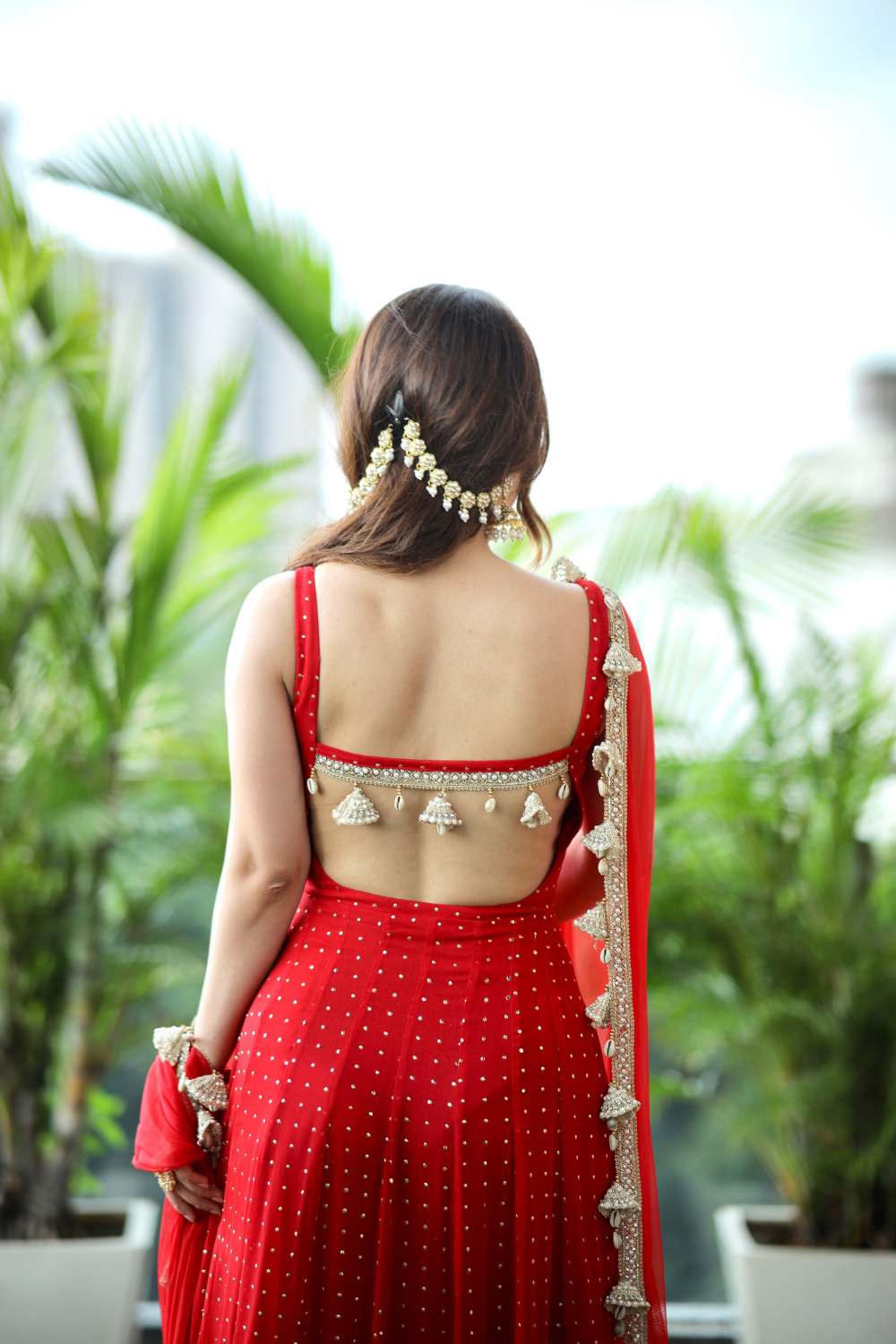 Imagine by Shiwali Dolly Red Anarkali dress with intricate embroidery and flowing fabric, displayed on a mannequin.