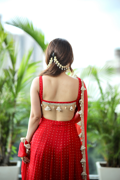 Imagine by Shiwali Dolly Red Anarkali dress with intricate embroidery and flowing fabric, displayed on a mannequin.