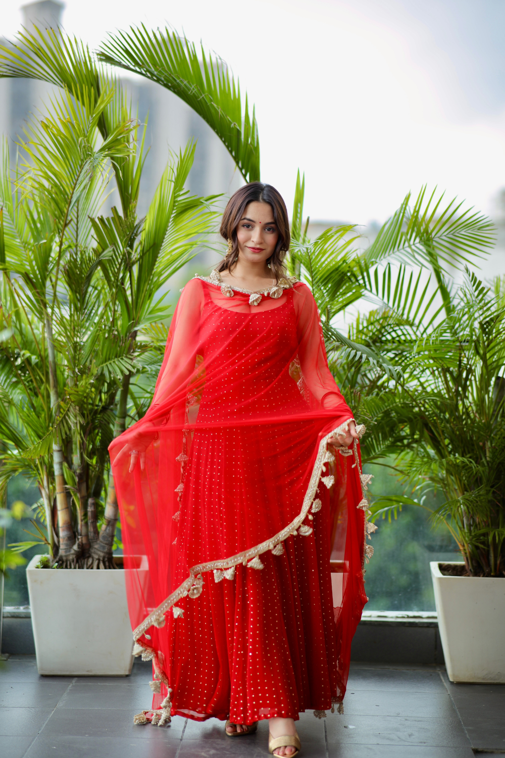 Imagine By Shiwali Dolly Red Anarkali dress with intricate embroidery and flowing fabric, displayed on a mannequin.