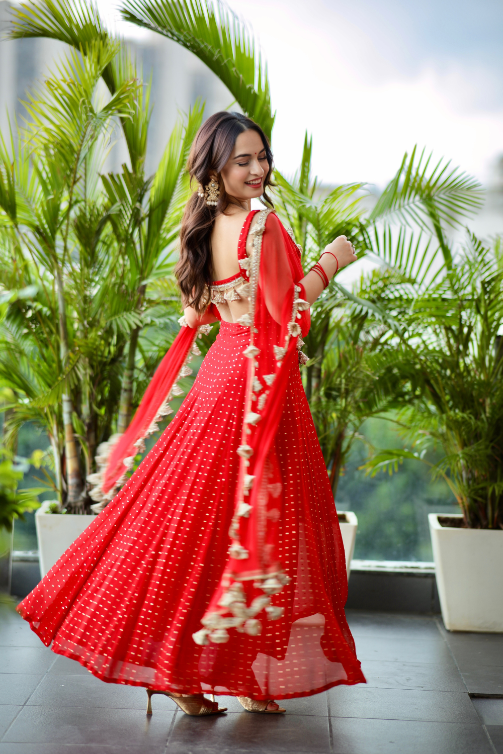 Red Dolly Anarkali dress by Imagine by Shiwali featuring intricate embroidery and flowing fabric with a fitted bodice.