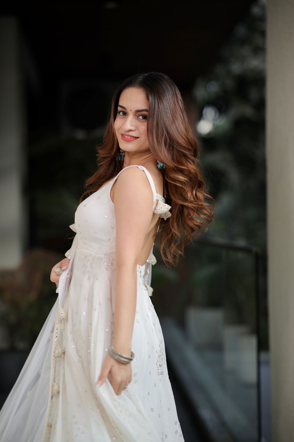Imagine By Shiwali Dolly White Anarkali dress with intricate embroidery and flowing fabric, displayed on a mannequin.
