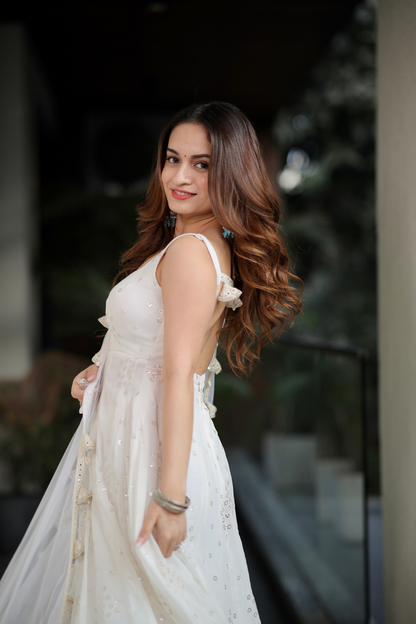 Imagine By Shiwali Dolly White Anarkali dress with intricate embroidery and flowing fabric, displayed on a mannequin.
