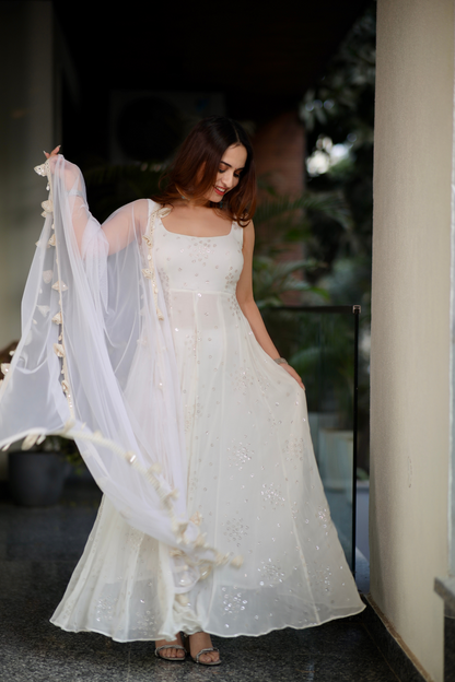 Imagine By Shiwali Dolly White Anarkali with intricate embroidery, flowing fabric, and traditional design for festive occasions.