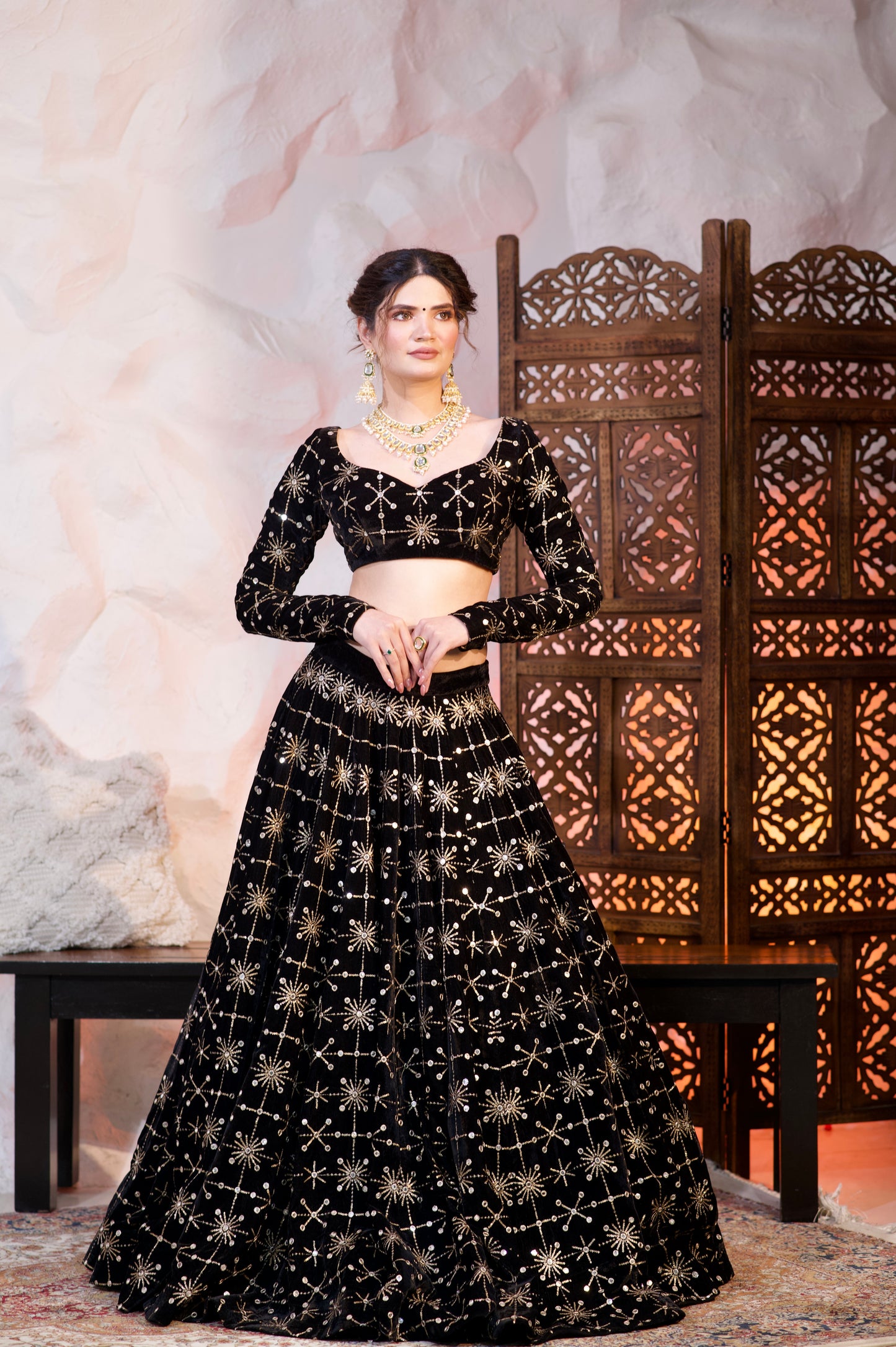 Black velvet lehnga by Imagine By Shiwali featuring intricate embroidery and traditional design for elegant Indian attire.