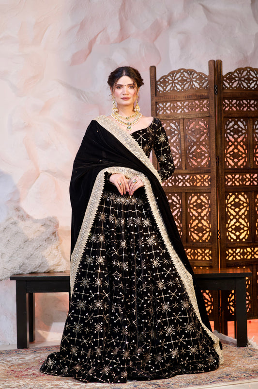 Black velvet Geetanjali lehnga by Imagine By Shiwali, featuring intricate embroidery and traditional design details.