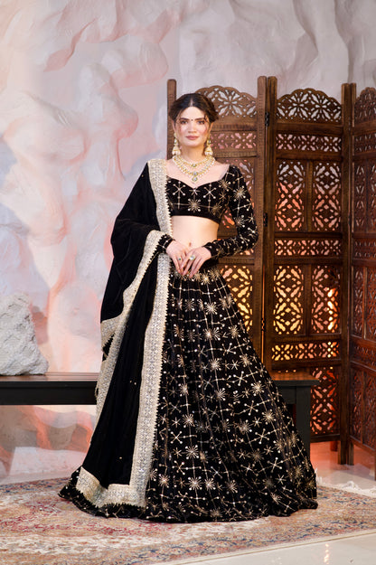 Black velvet lehenga by Imagine By Shiwali featuring intricate embroidery and traditional design, displayed on a mannequin.