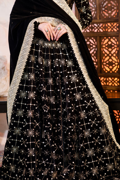 Black velvet Geetanjali lehnga by Imagine By Shiwali, showcasing intricate embroidery and traditional Indian attire style.