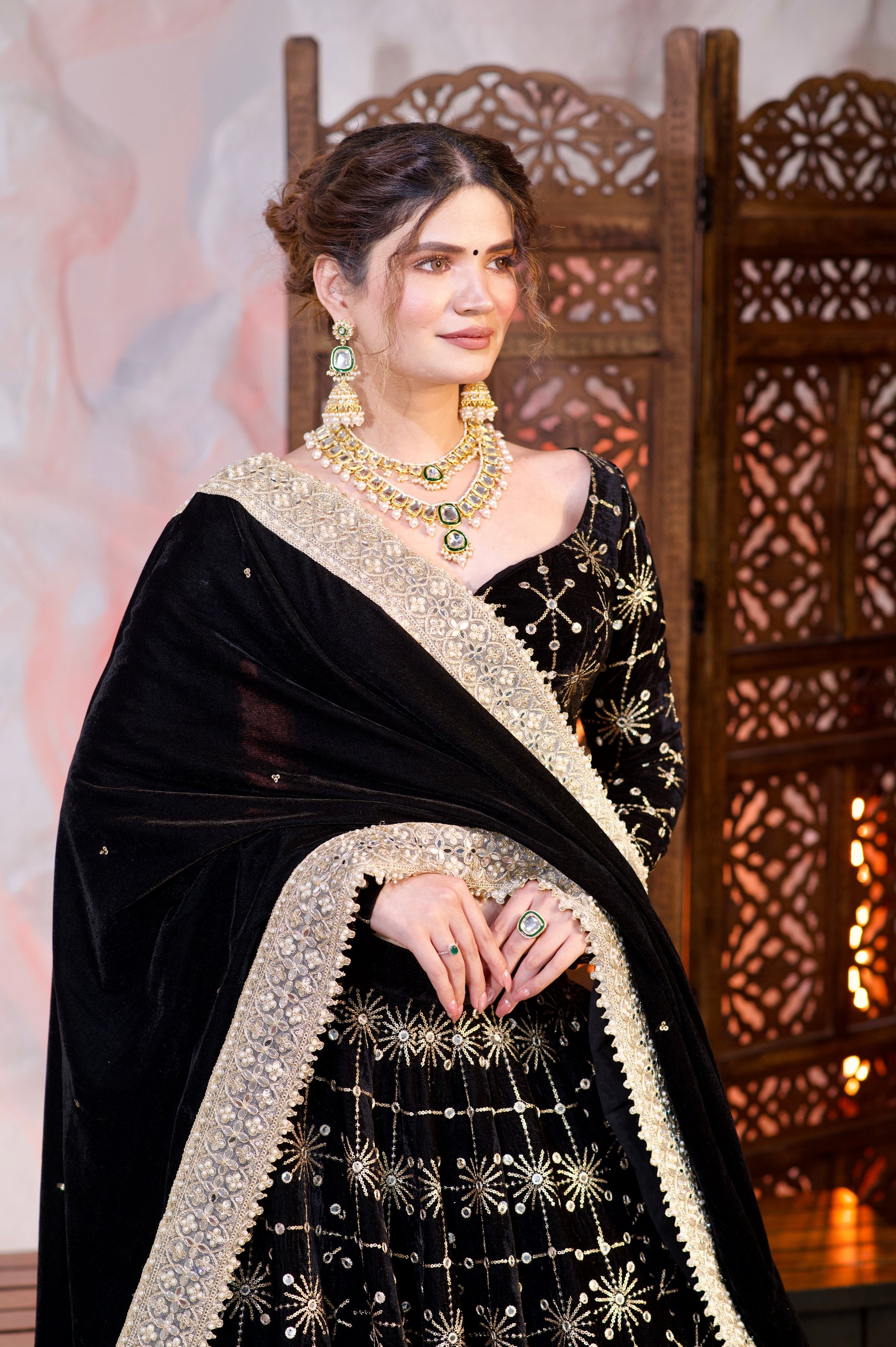 Black velvet lehnga by Imagine By Shiwali featuring intricate embroidery and elegant traditional design.