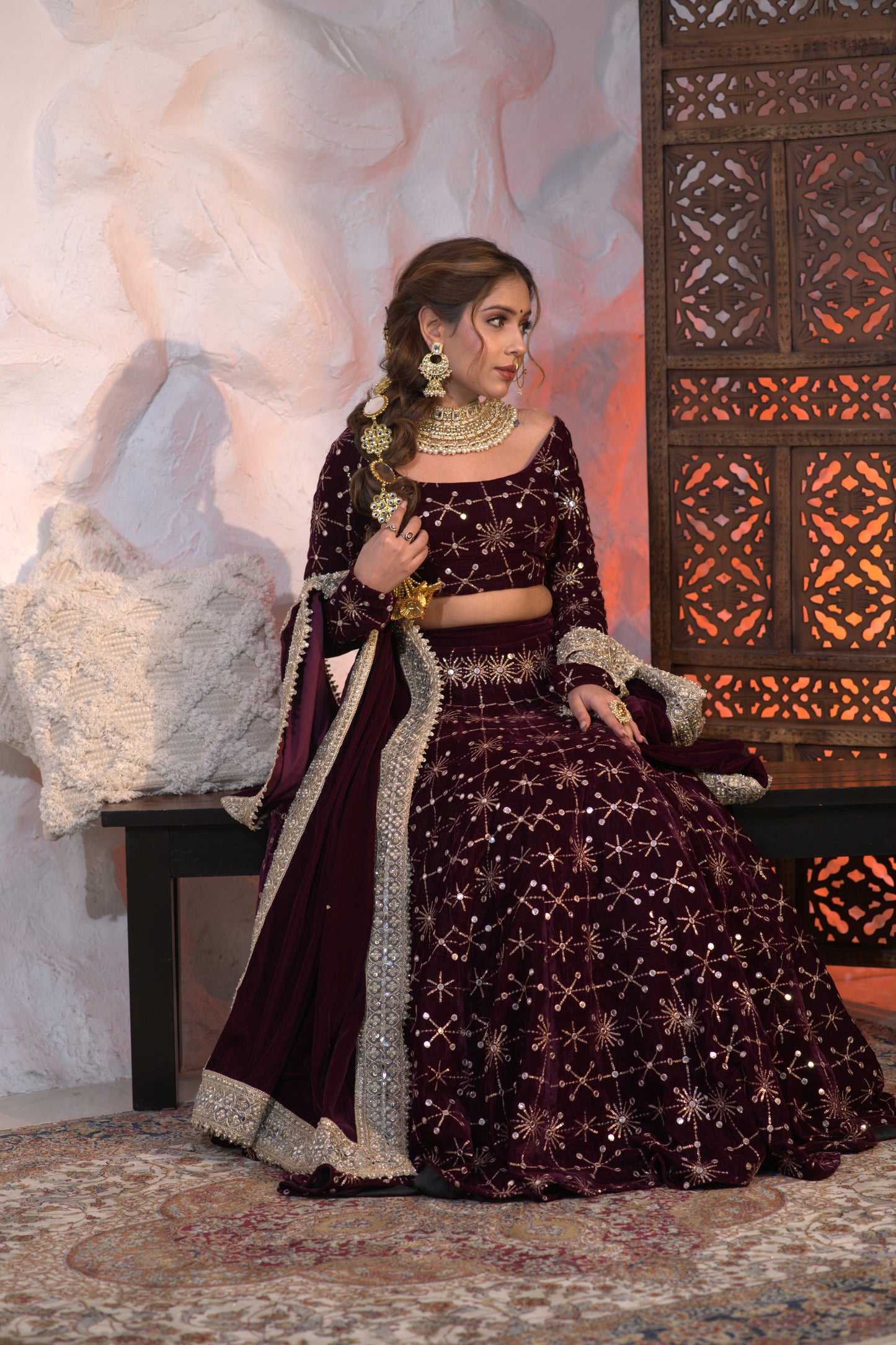 Elegant wine-colored velvet lehnga by Imagine By Shiwali featuring intricate embroidery and traditional design.