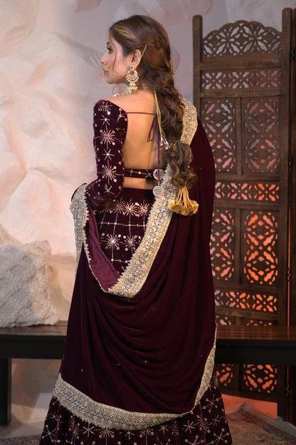 Wine-colored velvet lehnga by Imagine By Shiwali featuring intricate embroidery and traditional design.