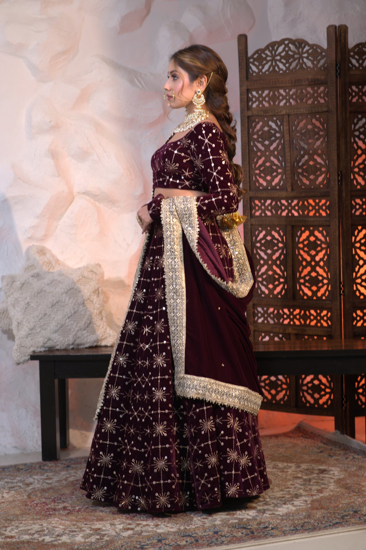 Wine-colored velvet lehnga by Imagine By Shiwali featuring intricate embroidery and a flowing, elegant design.