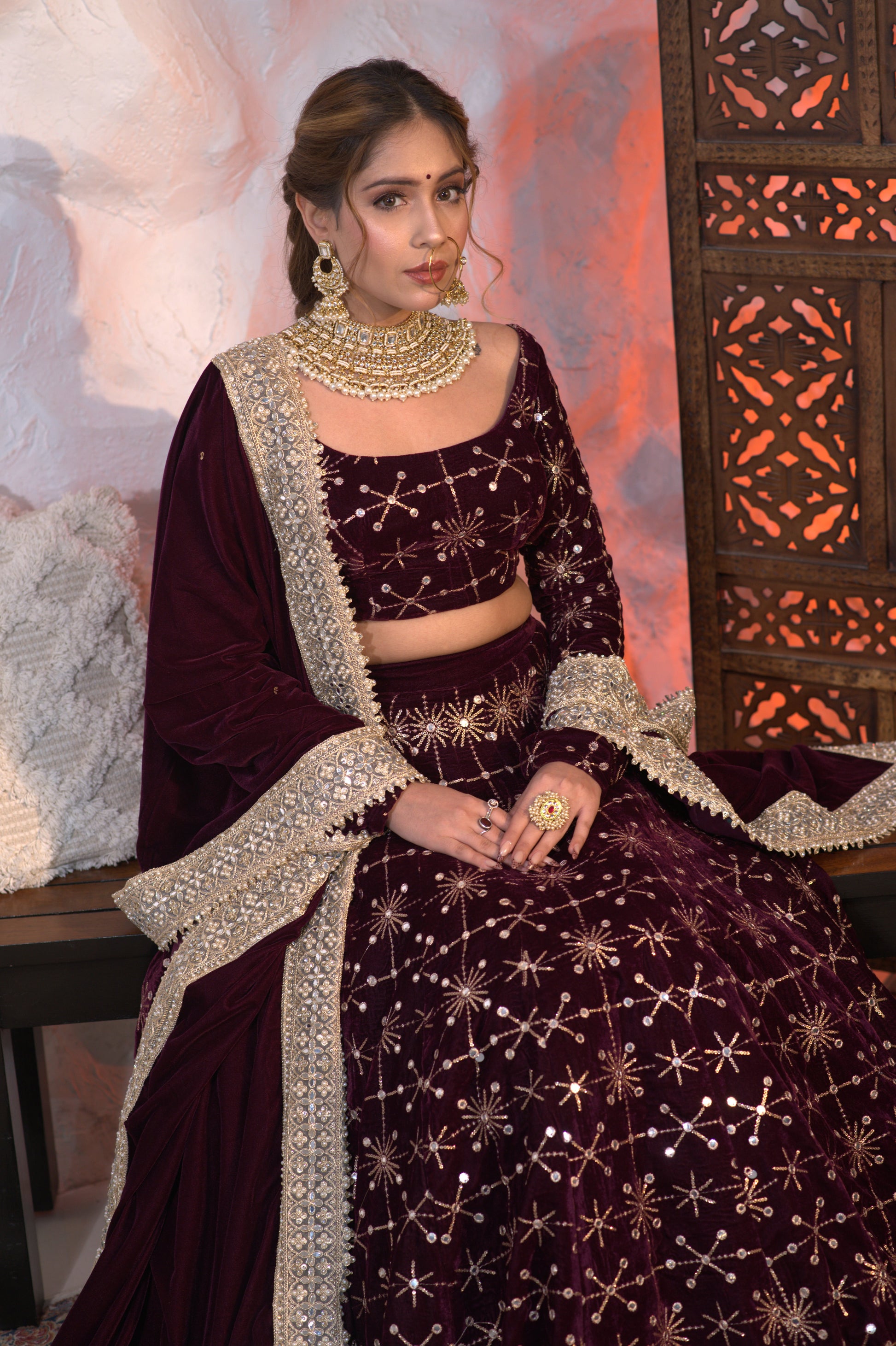 Wine-colored velvet Geetanjali lehnga by Imagine By Shiwali, featuring intricate embroidery and traditional design.