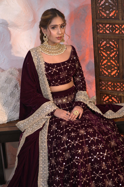 Wine-colored velvet Geetanjali lehnga by Imagine By Shiwali, featuring intricate embroidery and traditional design.