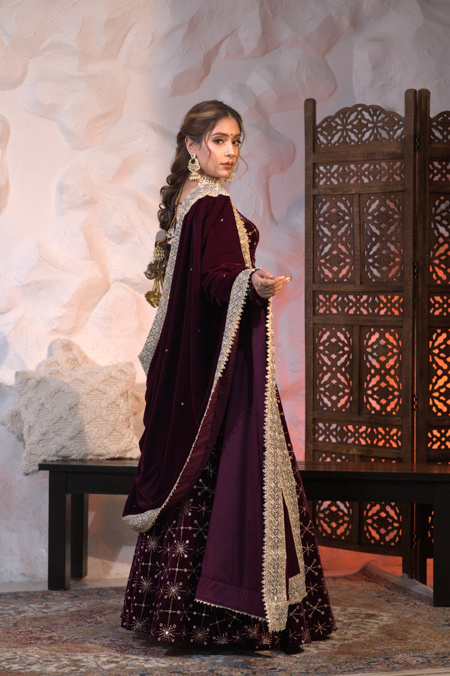 Imagine by Shiwali Geetanjali velvet lehnga in rich wine color, featuring intricate embroidery and luxurious fabric.