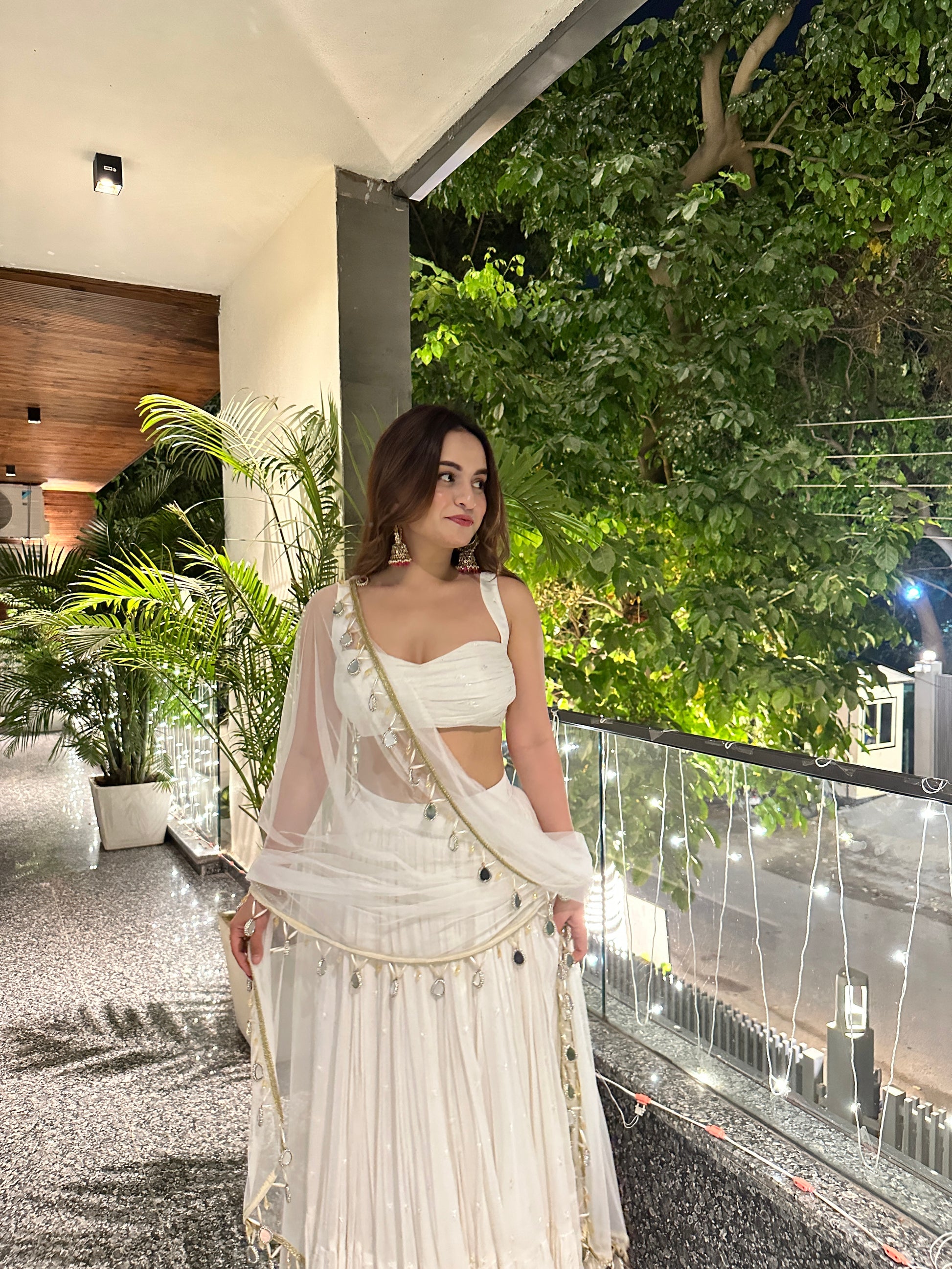 Elegant white Lehnga by Imagine by Shiwali featuring intricate embroidery and traditional design, perfect for special occasions.